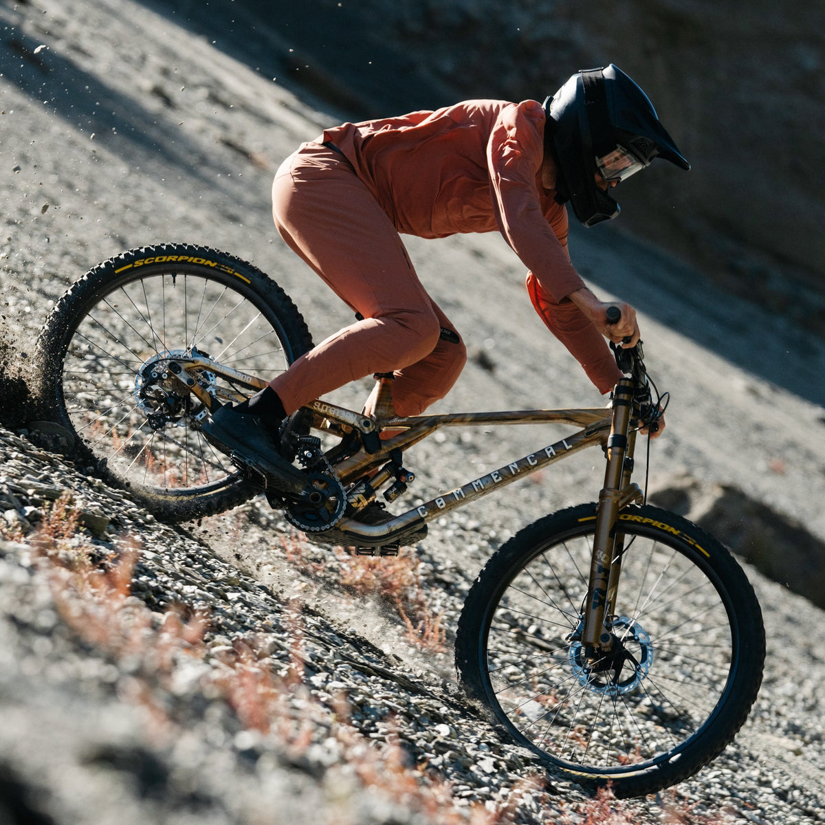 Brett Rheeder riding a downhill commencal mountain bike wearing signature augusta riding pants and jersey